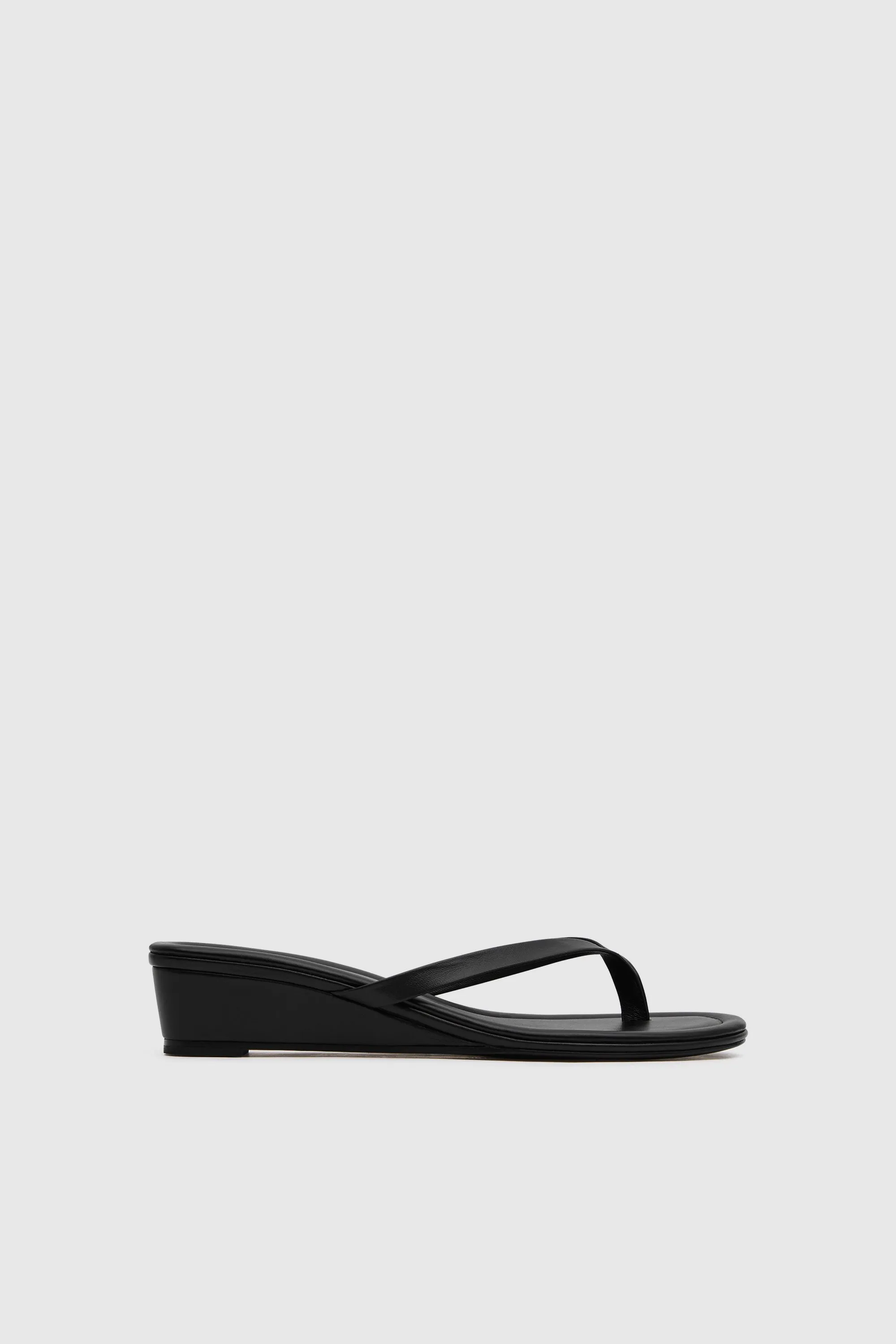Thong Wedge - Black sold by St. Agni