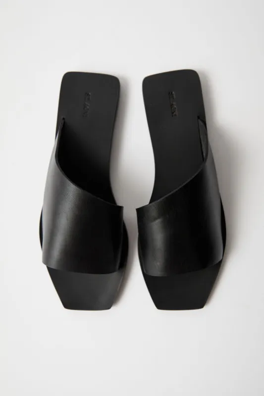 Asymmetric Slide - Black sold by St. Agni
