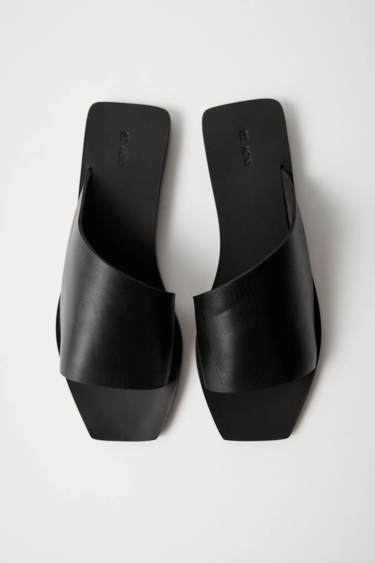 Asymmetric Slide - Black sold by St. Agni