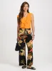 Ruffled Sleeveless Top sold by Laura