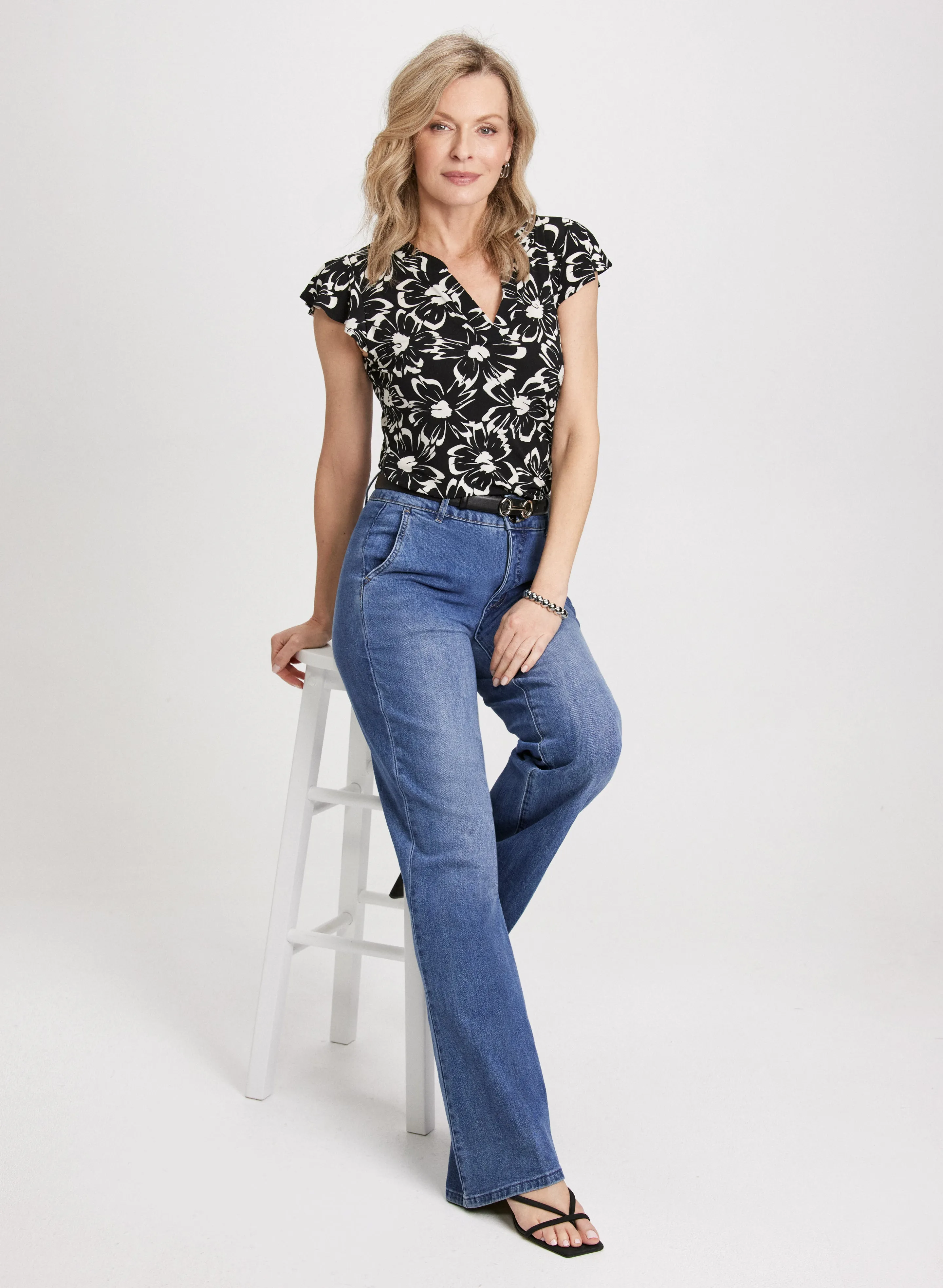 Ruffle Floral Top & Flared Denim Pants sold by Laura