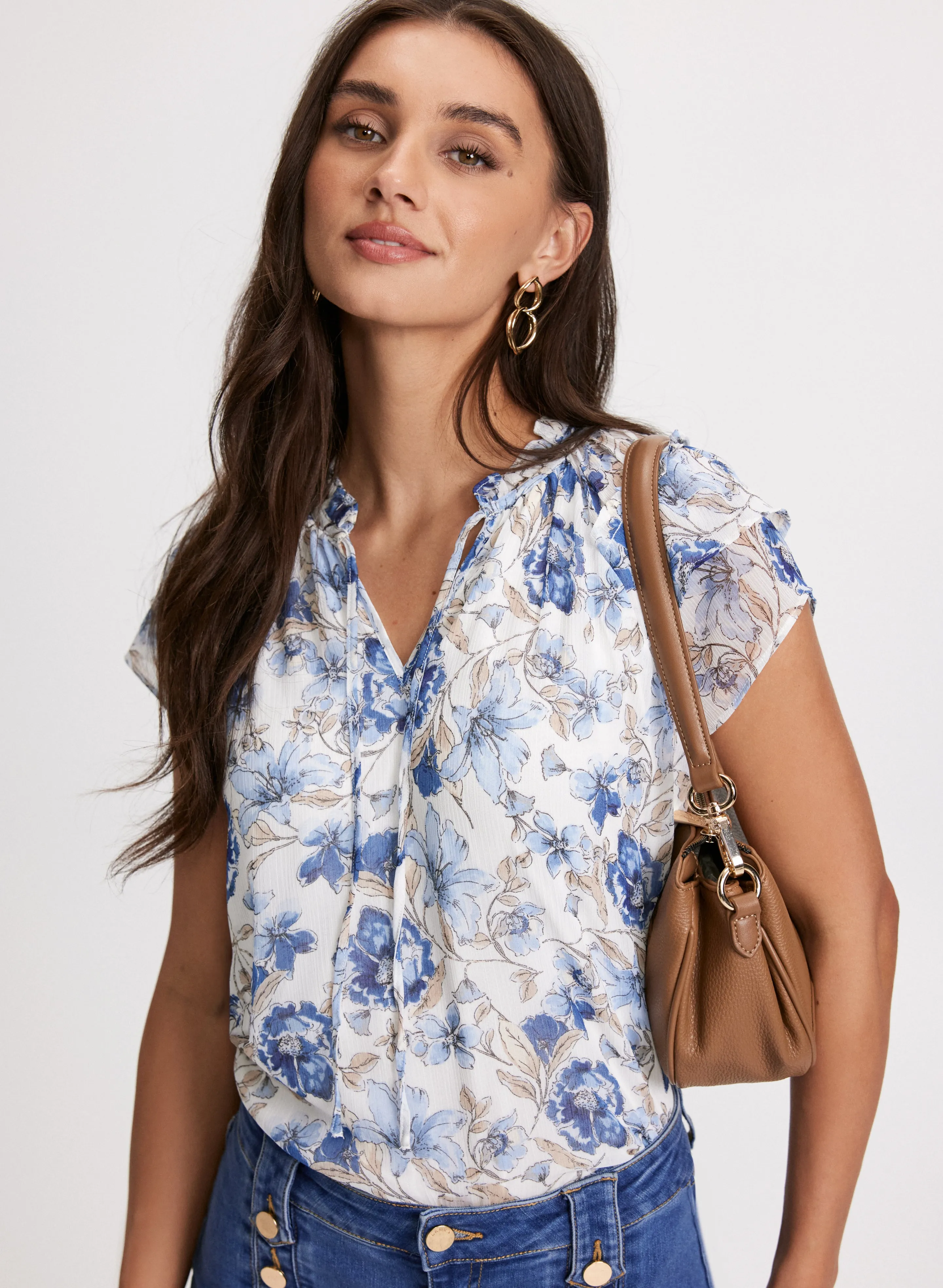 Floral Flutter Sleeve Top sold by Laura