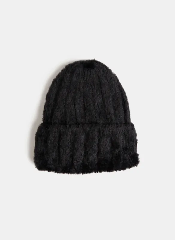 Feather Yarn Tuque sold by Laura