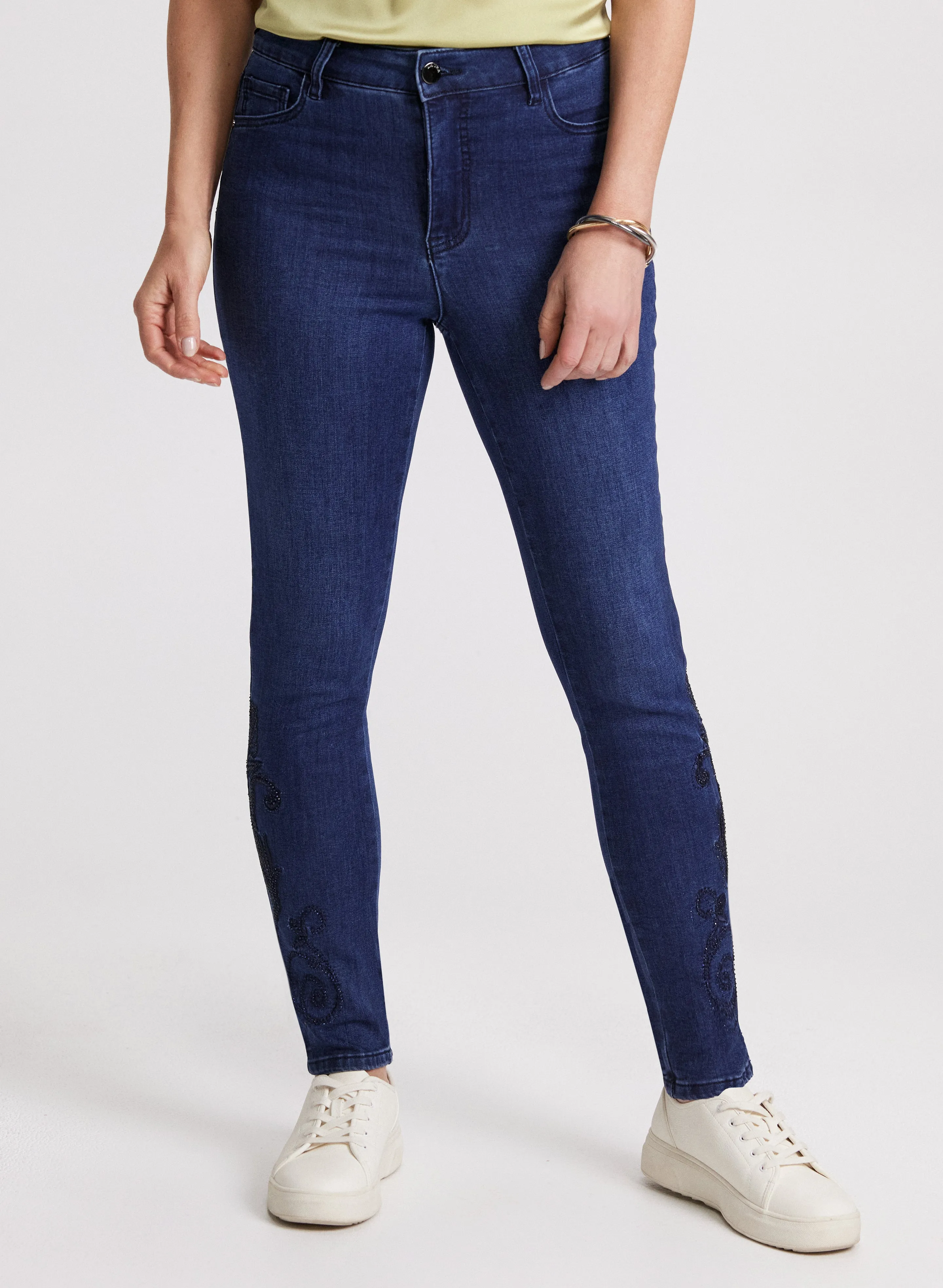 Embroidered Hem Slim Leg Jeans sold by Laura