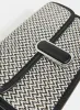 Two-Tone Woven Handbag sold by Laura