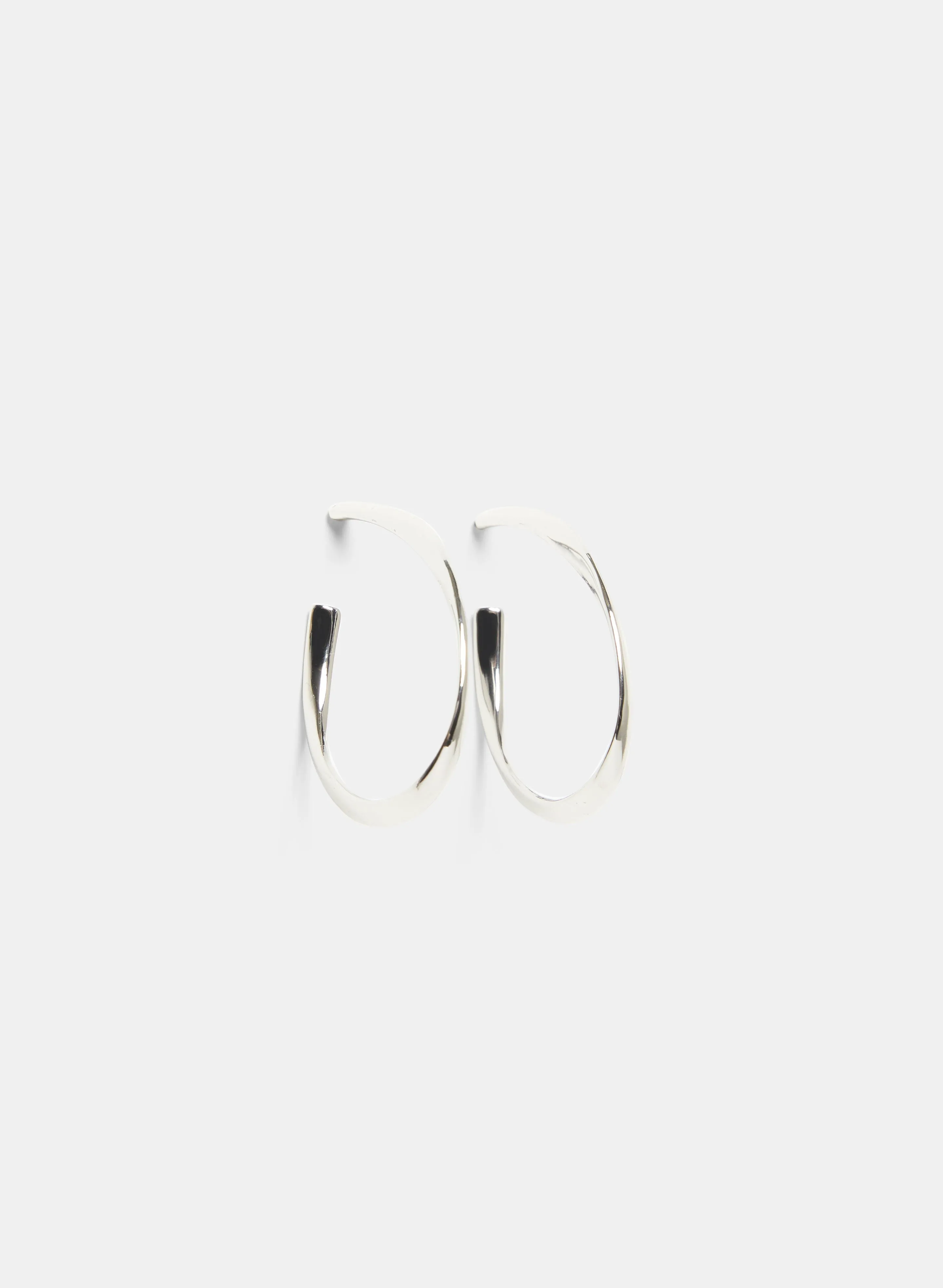 Curved Hoop Earrings sold by Laura