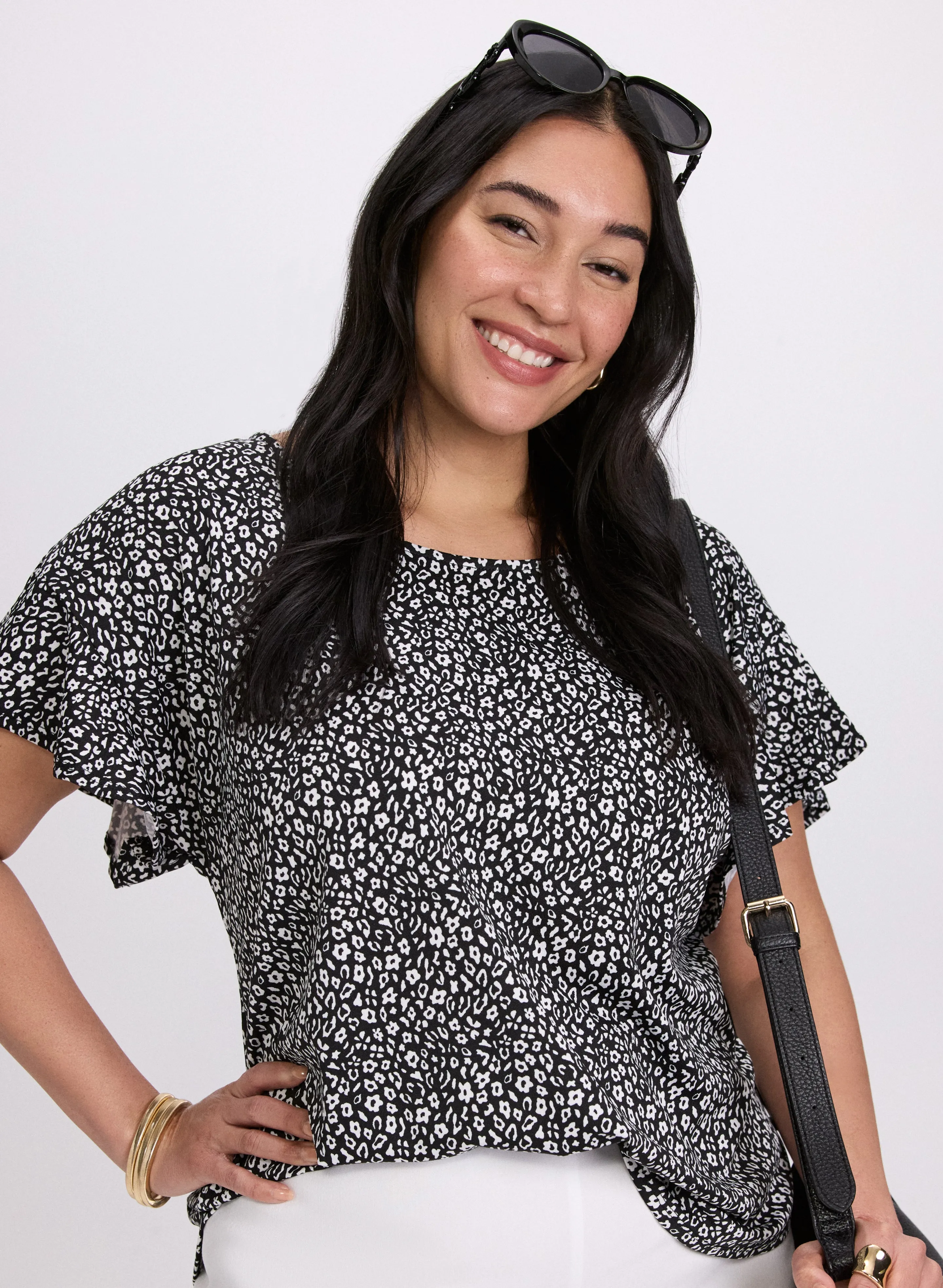 Floral Flutter Sleeve Top sold by Laura