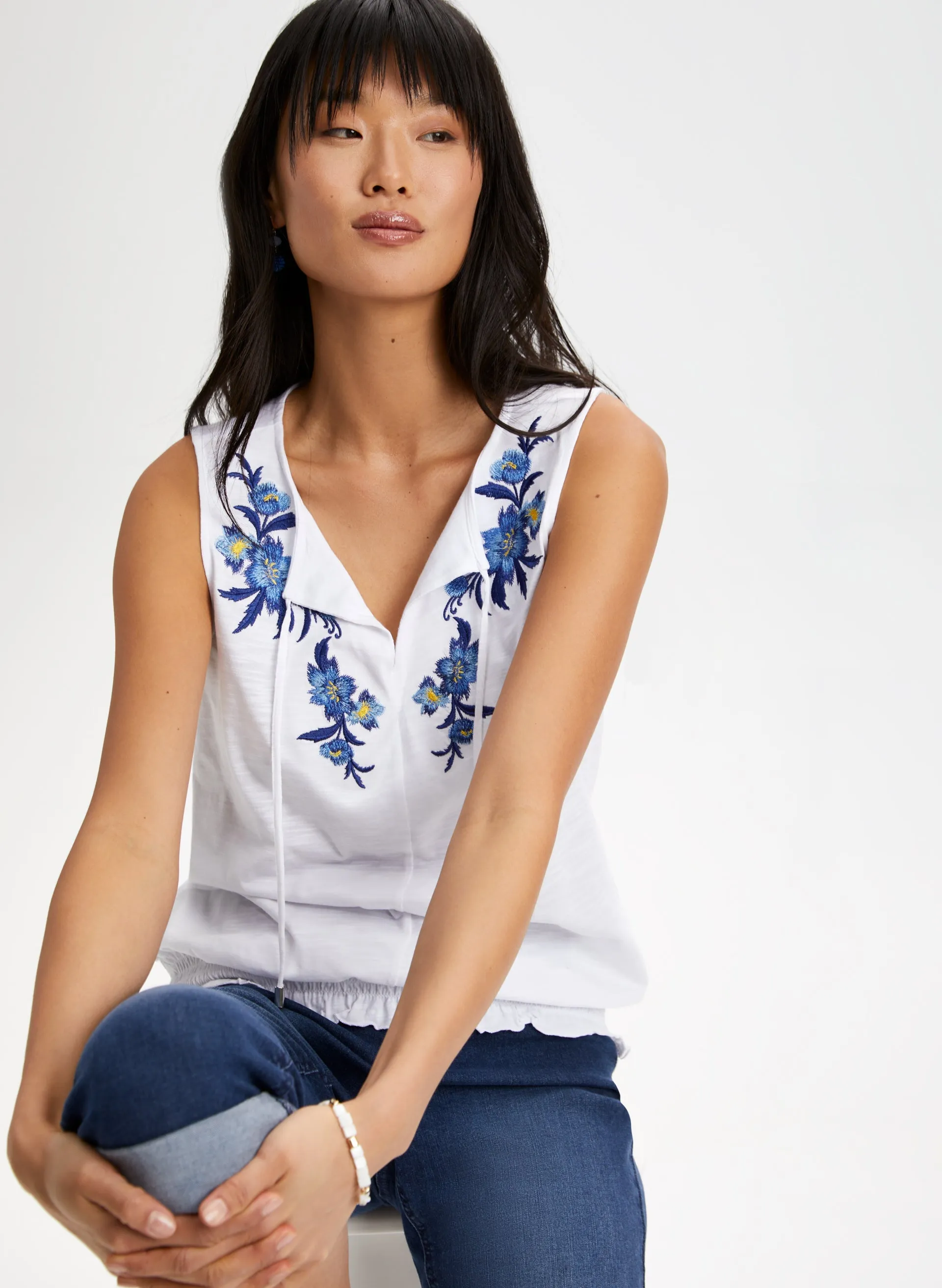 Embroidered Smocked Hem Top sold by Laura