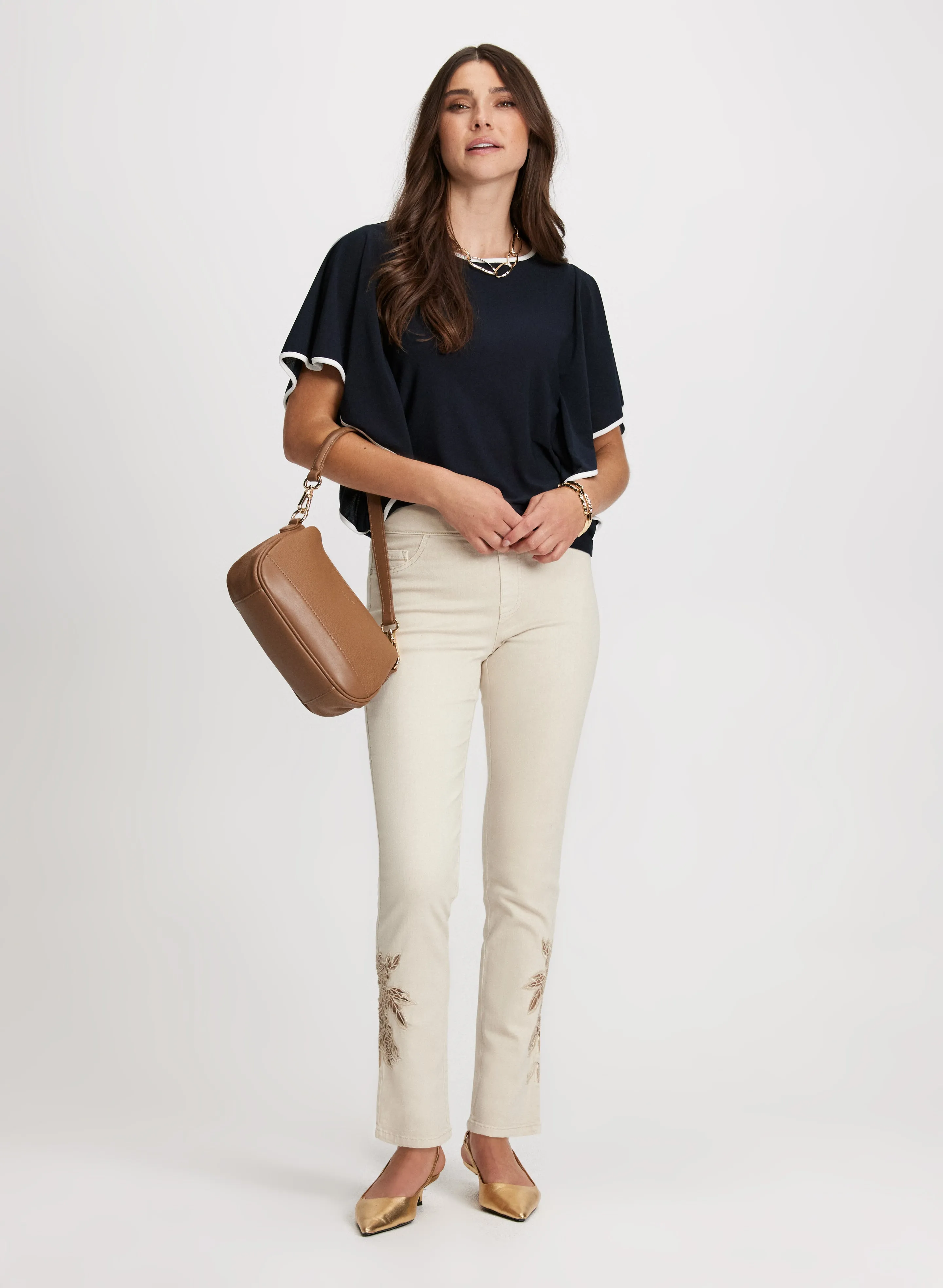 Ruffle Sleeve Top & Rose Applique Jeans sold by Laura