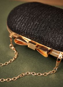 Bow Detail Clutch sold by Laura