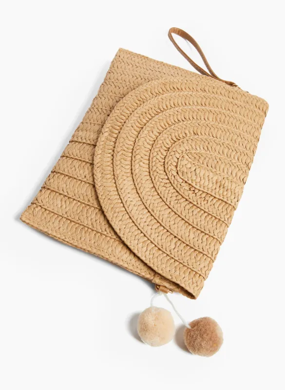 Straw Pom Pom Purse sold by Laura