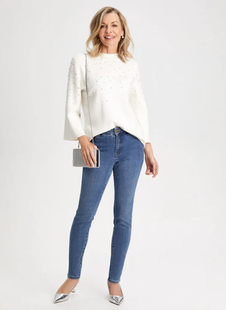 Embellished Sweater & Slim Leg Jeans sold by Laura