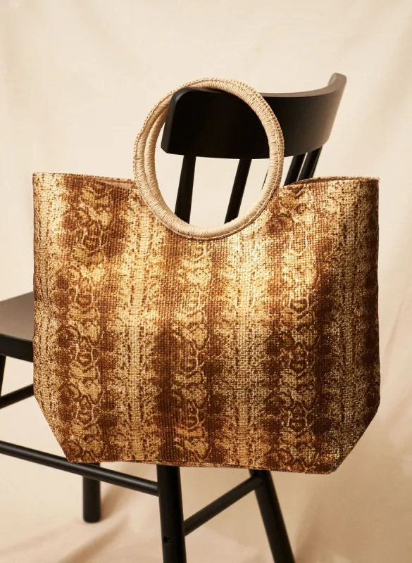 Snake Motif Straw Beach Bag sold by Laura