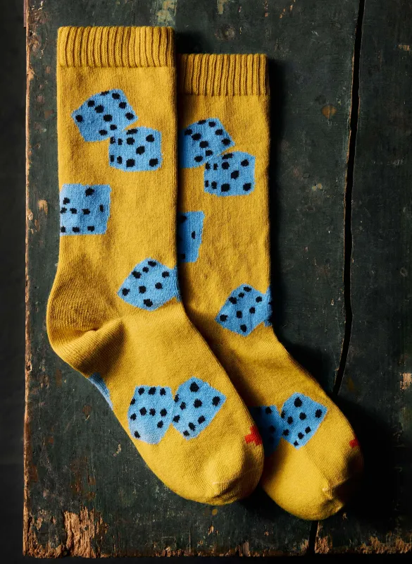 the "tumblin dice" sock in gold sold by Imogene + Willie