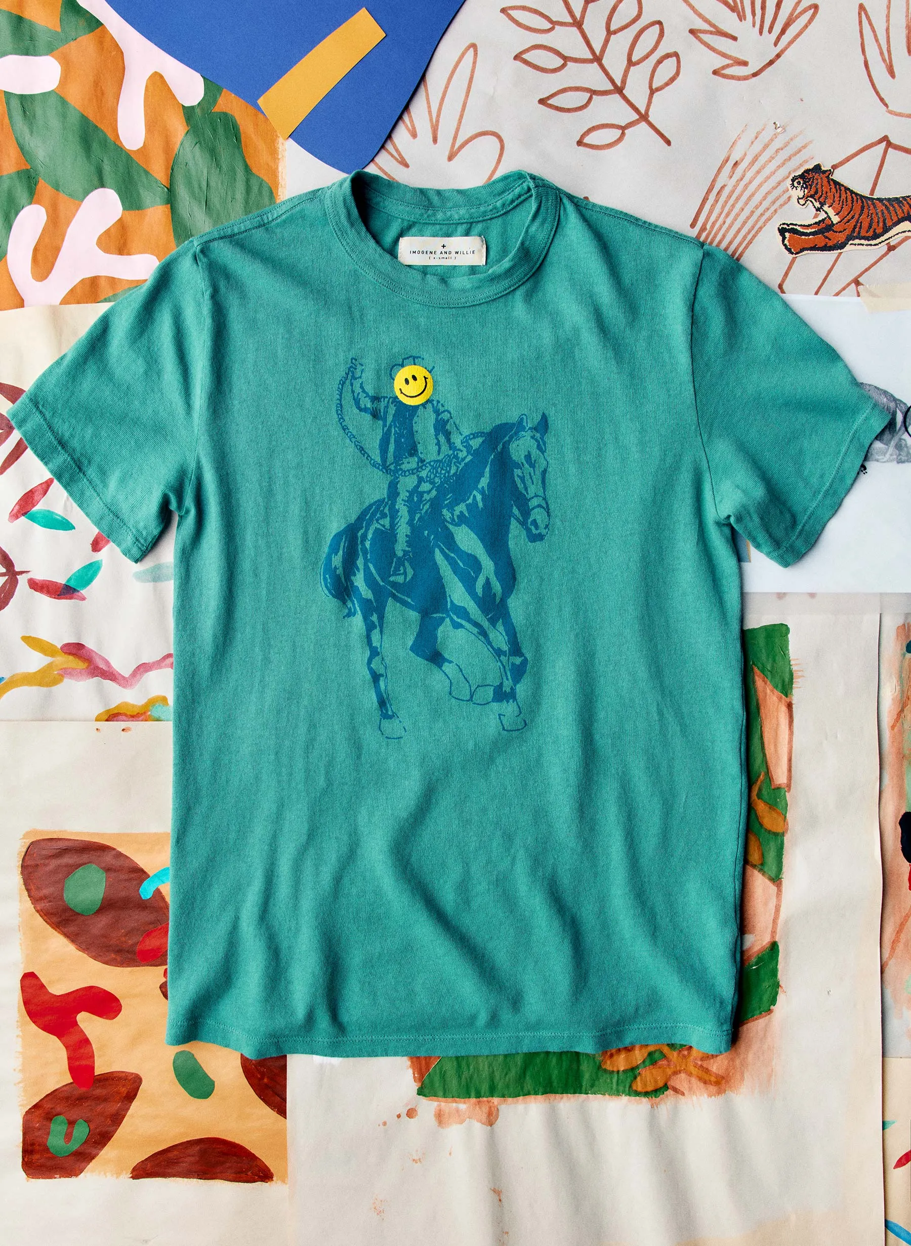 the "happy rider" tee sold by Imogene + Willie