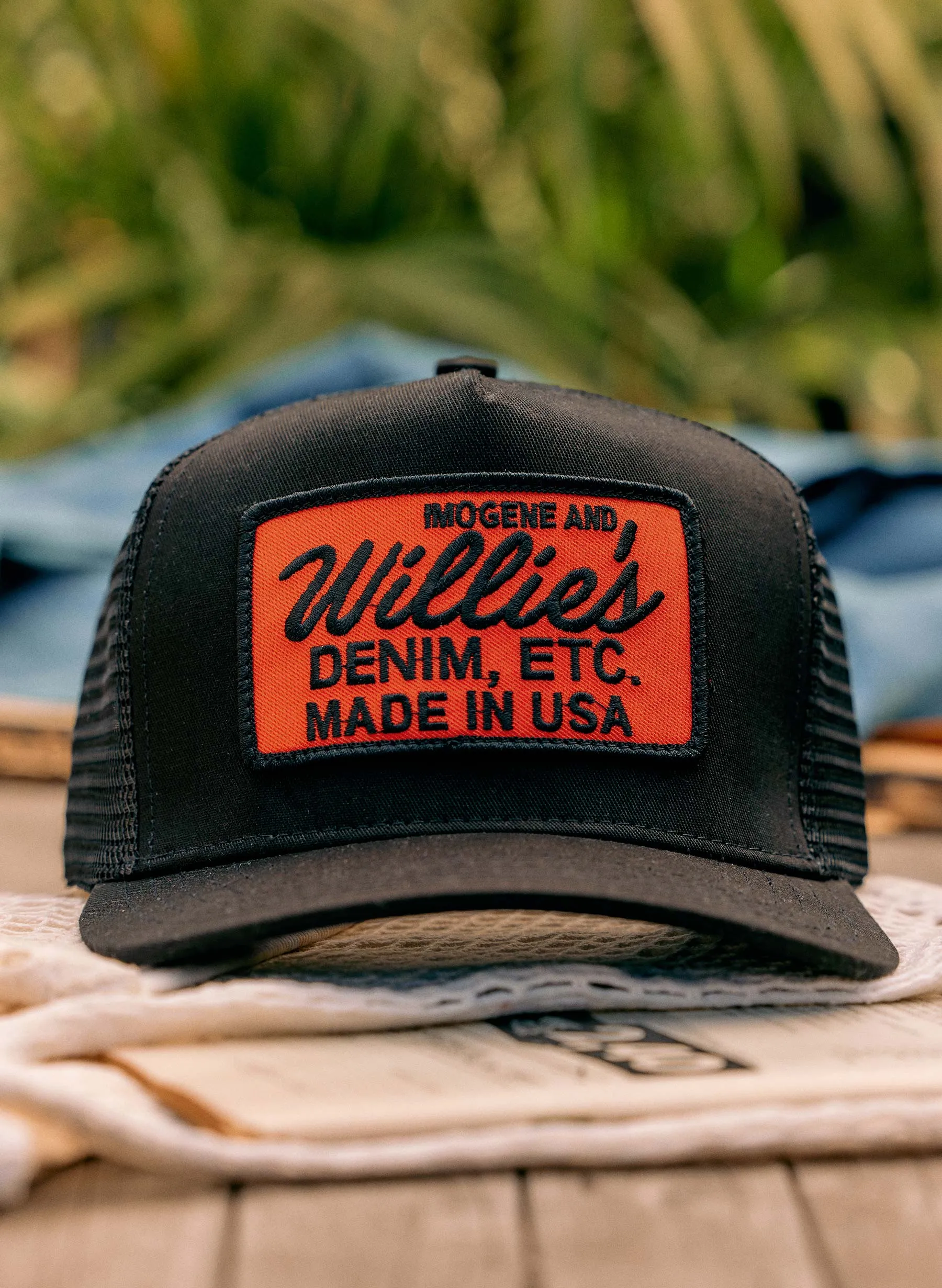 the "denim etc" trucker in black sold by Imogene + Willie