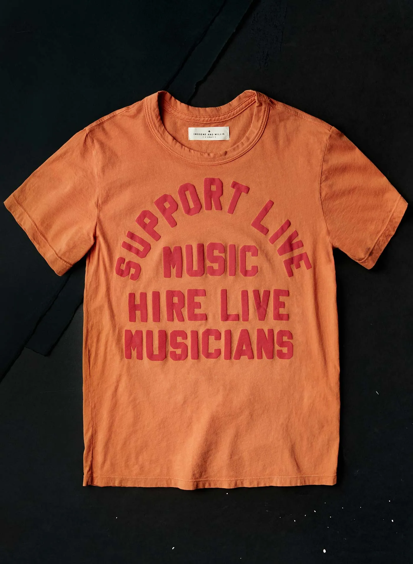 the "support live music" tee in orange sold by Imogene + Willie