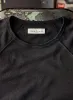 the long sleeve raglan in faded black sold by Imogene + Willie