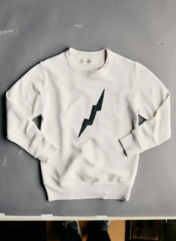 the "bolt" sweatshirt in white sold by Imogene + Willie