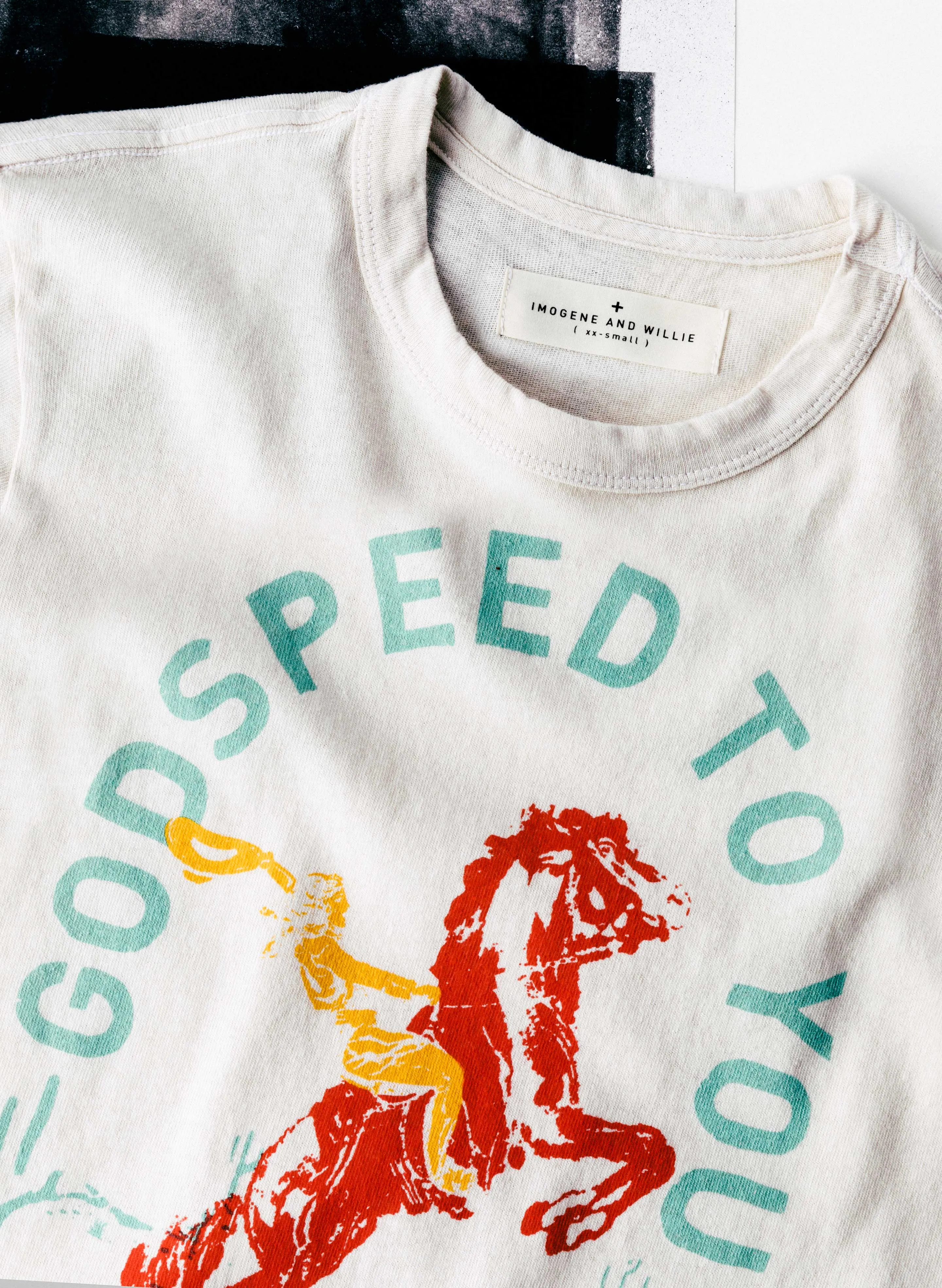 the "godspeed" tee in vintage white sold by Imogene + Willie