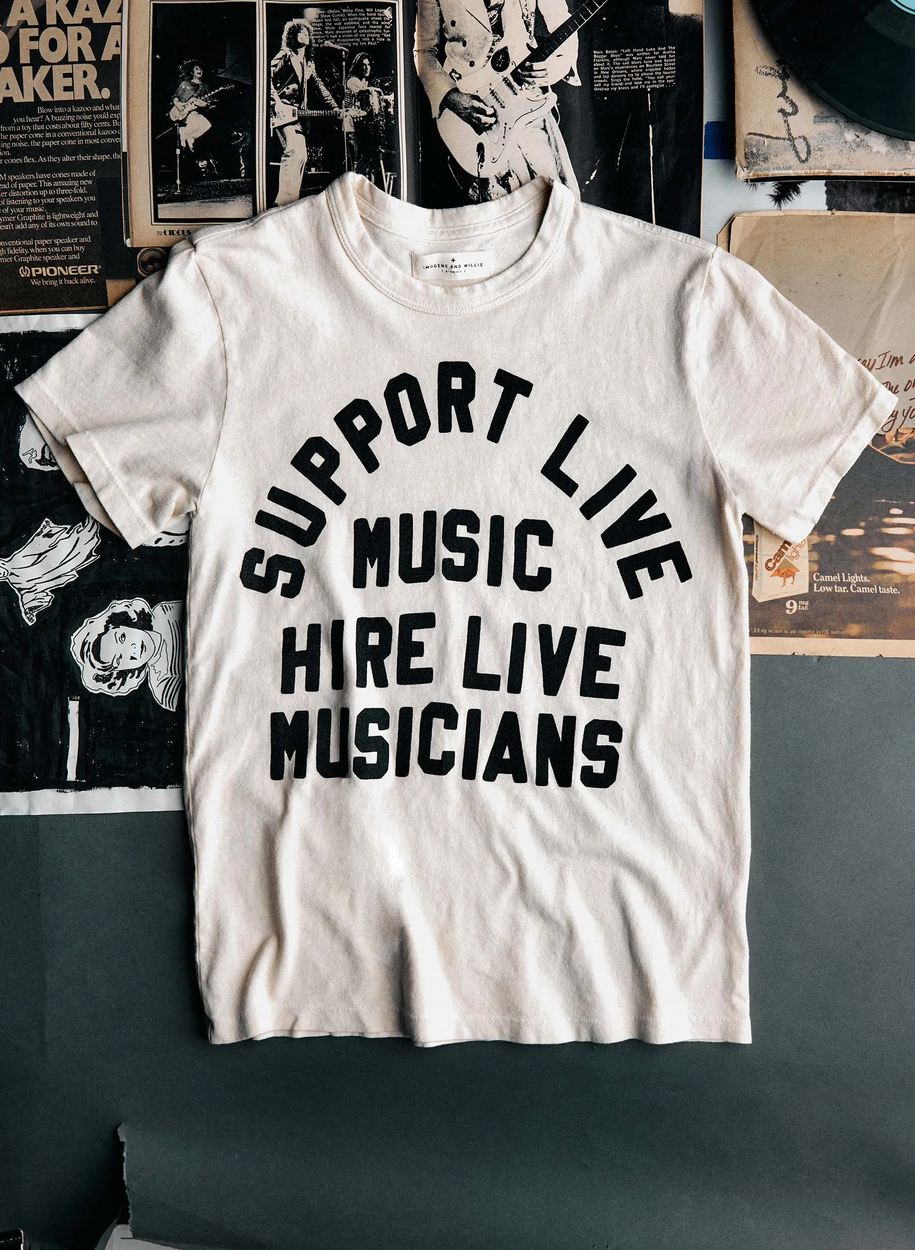 the "support live music" tee in vintage white sold by Imogene + Willie