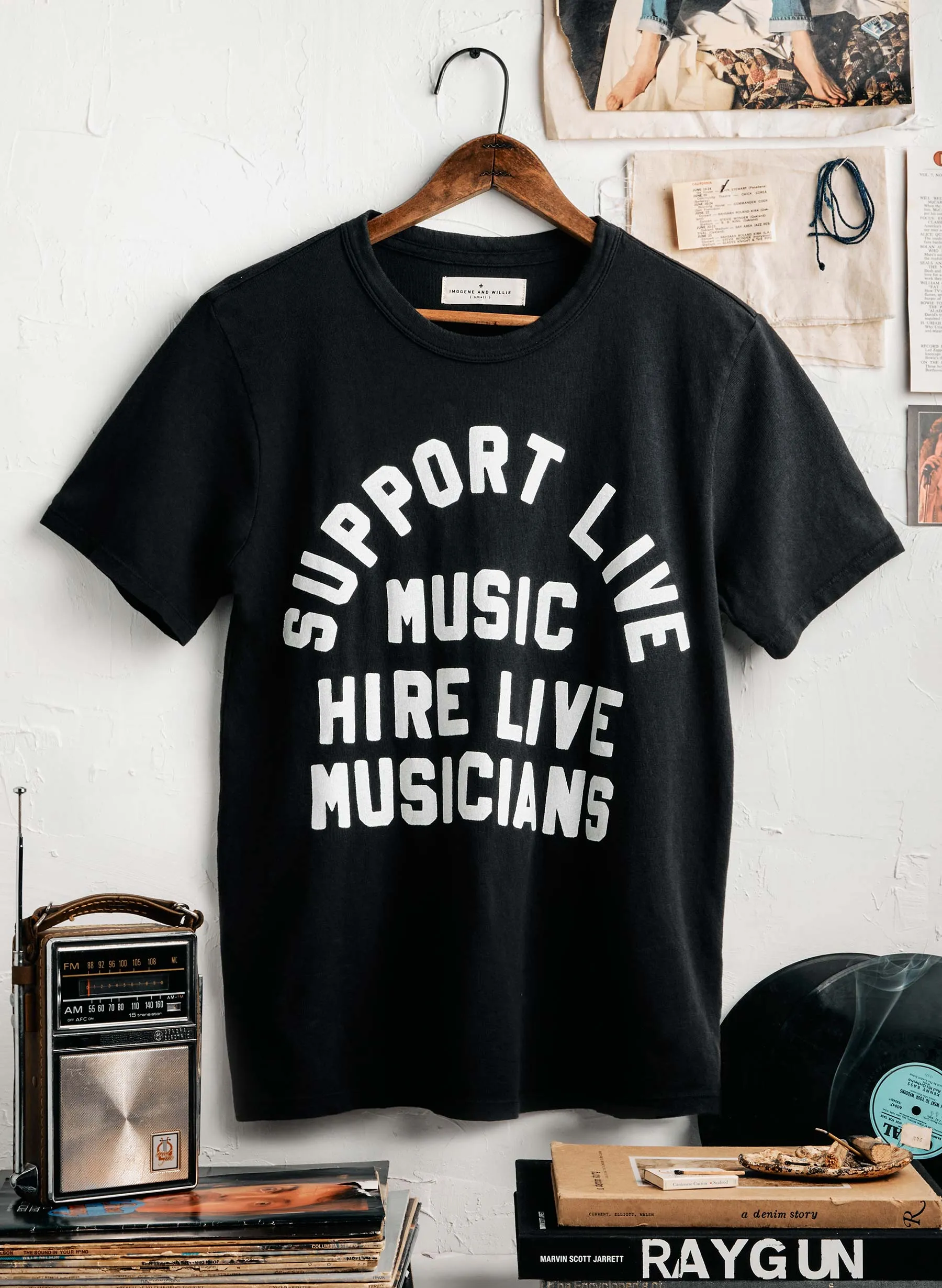 the "support live music" tee in black sold by Imogene + Willie