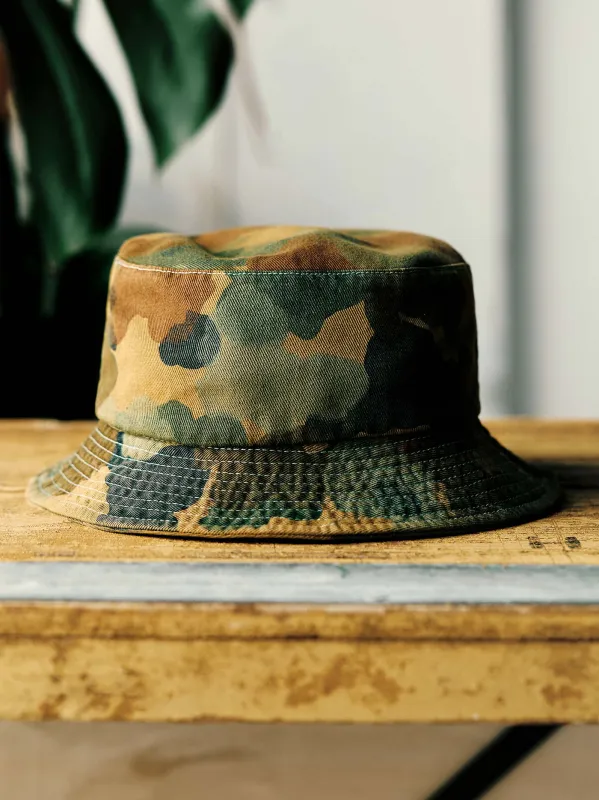painted camo bucket hat sold by Imogene + Willie