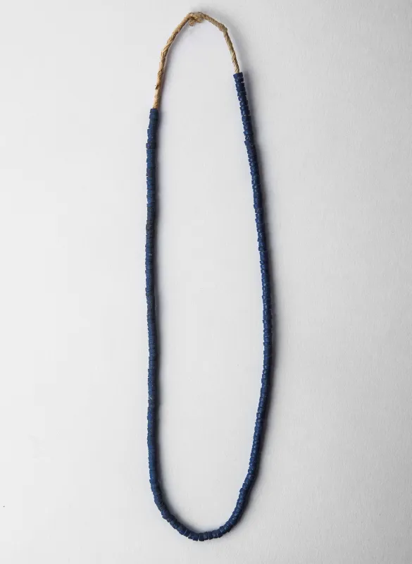 handcut bottone blue glass necklace sold by Imogene + Willie