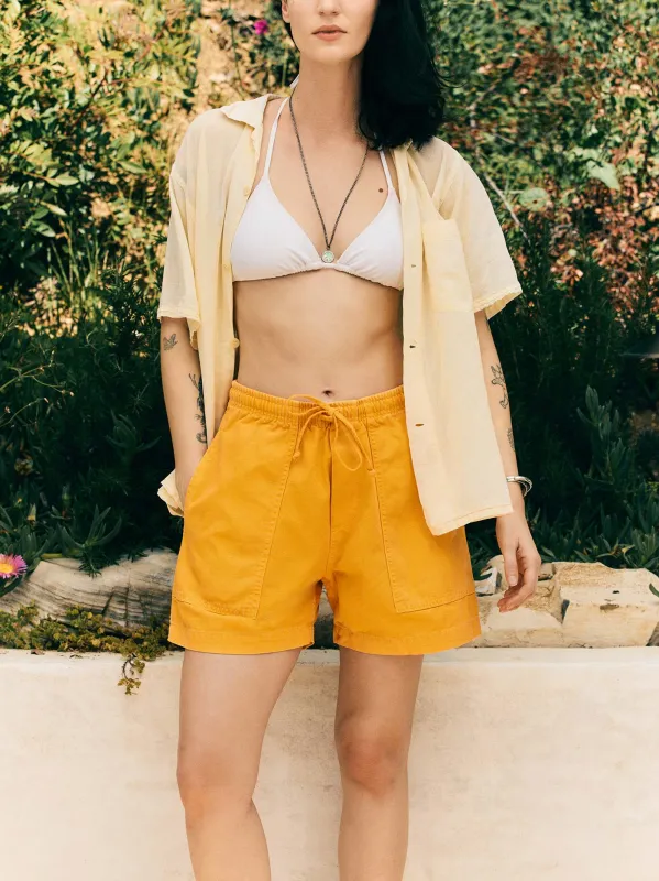 the canvas lounge short in marigold sold by Imogene + Willie