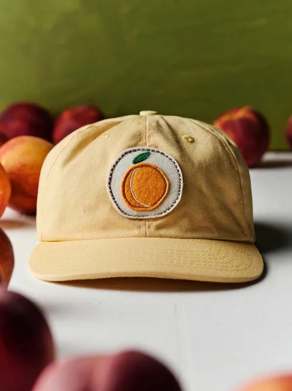 the "peach truck" cap sold by Imogene + Willie