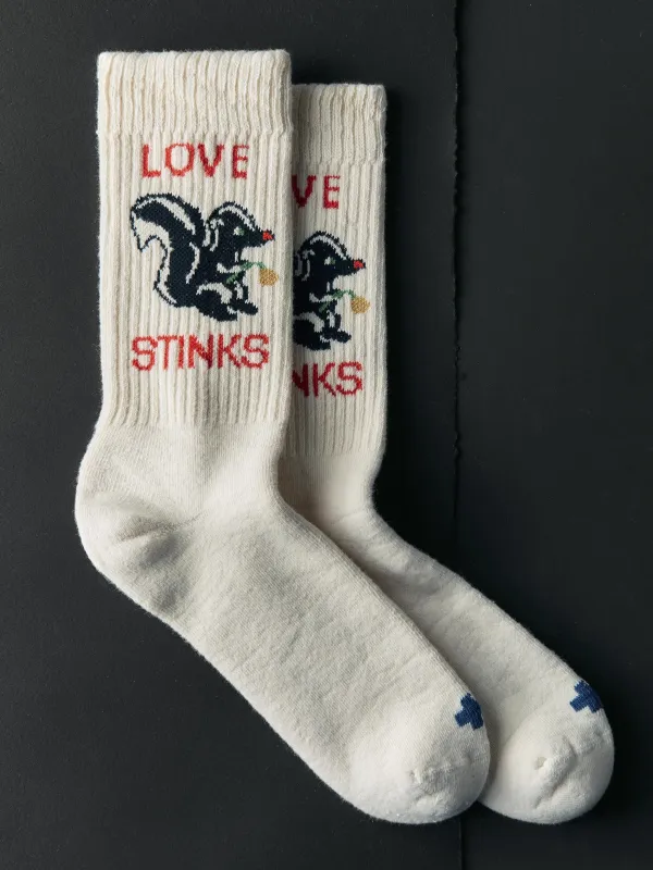 the "love stinks" sock sold by Imogene + Willie
