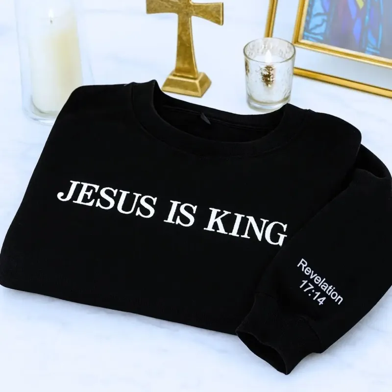 Embroidered Jesus Is King Sweatshirt with Custom Text on Sleeve sold by Embroly