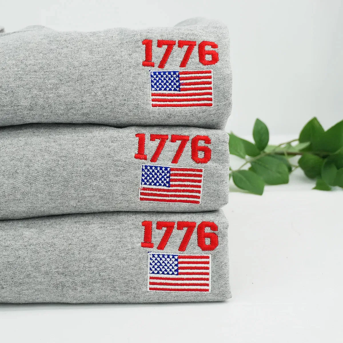 Embroidered 1776 American Flag Sweatshirt or Hoodie – 4th of July Patriotic Apparel sold by Embroly