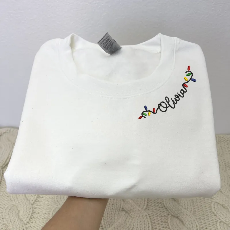 Custom Embroidered Christmas Sweatshirt, Personalized Christmas Light Name on Neckline Crewneck or Hoodie made by Embroly