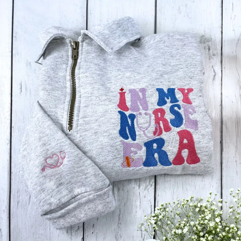 In My Nurse Era Zip Sweatshirt or Hoodie, Personalized Embroidered Gift For Nurse sold by Embroly