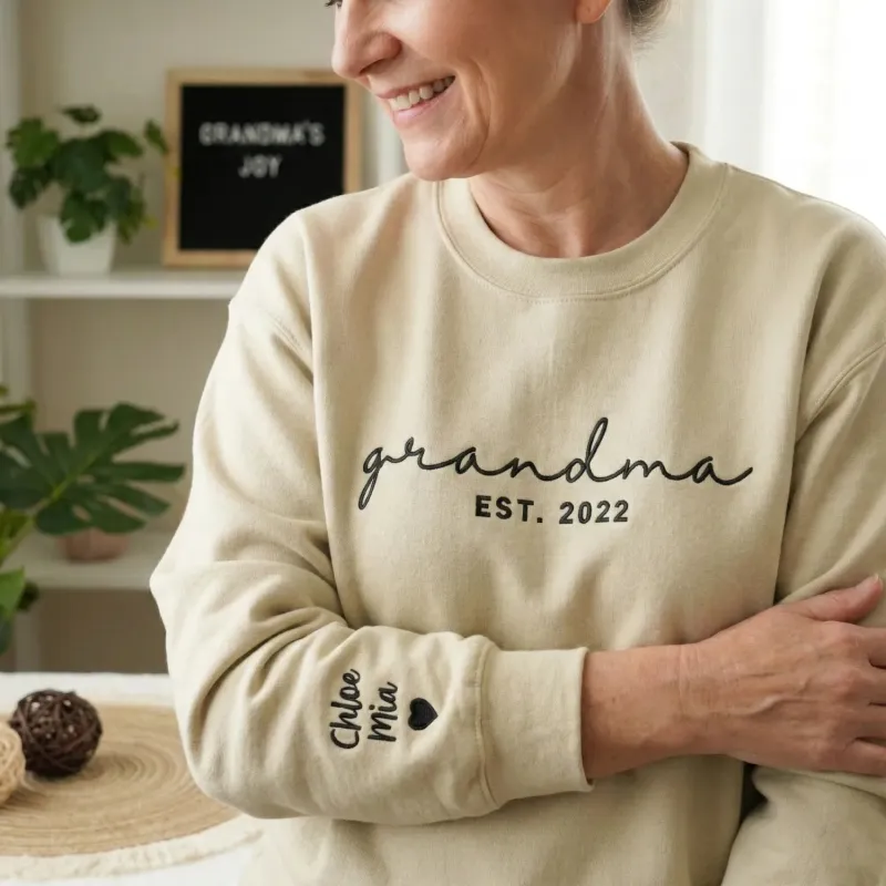 First Time Grandma Sweatshirt - Personalized Mother’s Day Gift with Embroidered Sweater Name on Sleeve made by Embroly