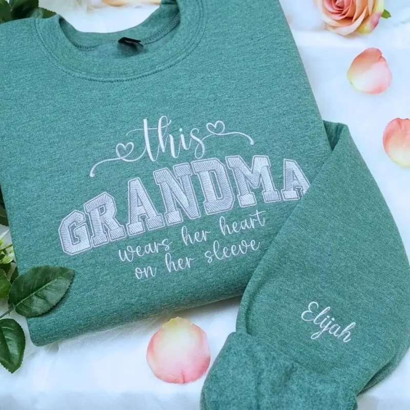 Personalized Grandma Gift with Embroidered This Grandma Wears Her Heart on Her Sleeve Sweatshirt made by Embroly