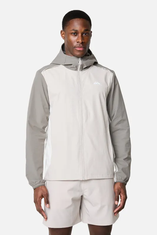 SS26 Triathlon Windbreaker - Pebble Stone/Mocha/Frosted Ridge made by Trailberg