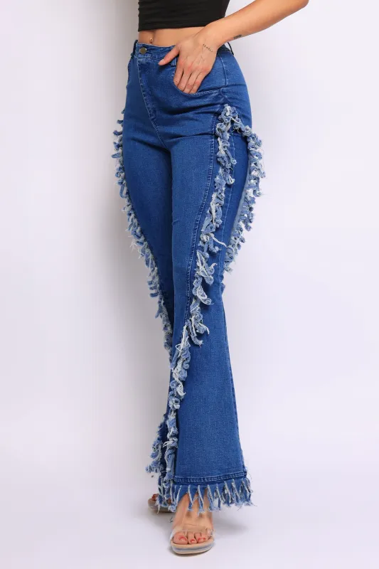 Distressed fringe denim flared pant sold by Bogomore