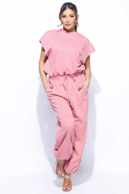 Open back jogger jumpsuit sold by Bogomore