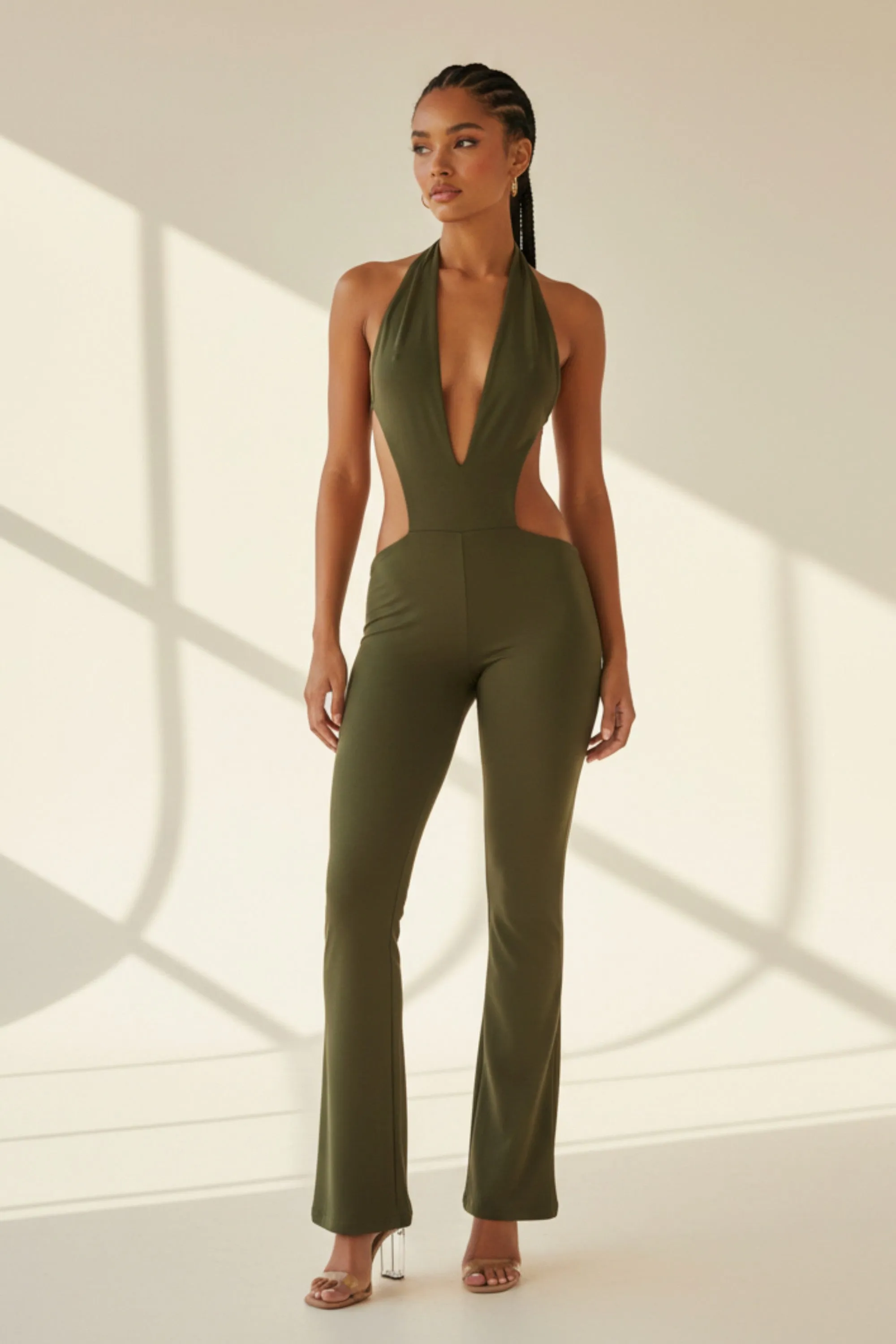 After Hours Deep Plunge Flare Jumpsuit sold by Bogomore