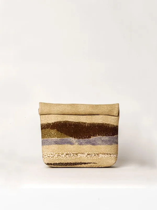 Roll Up Clutch sold by Cord