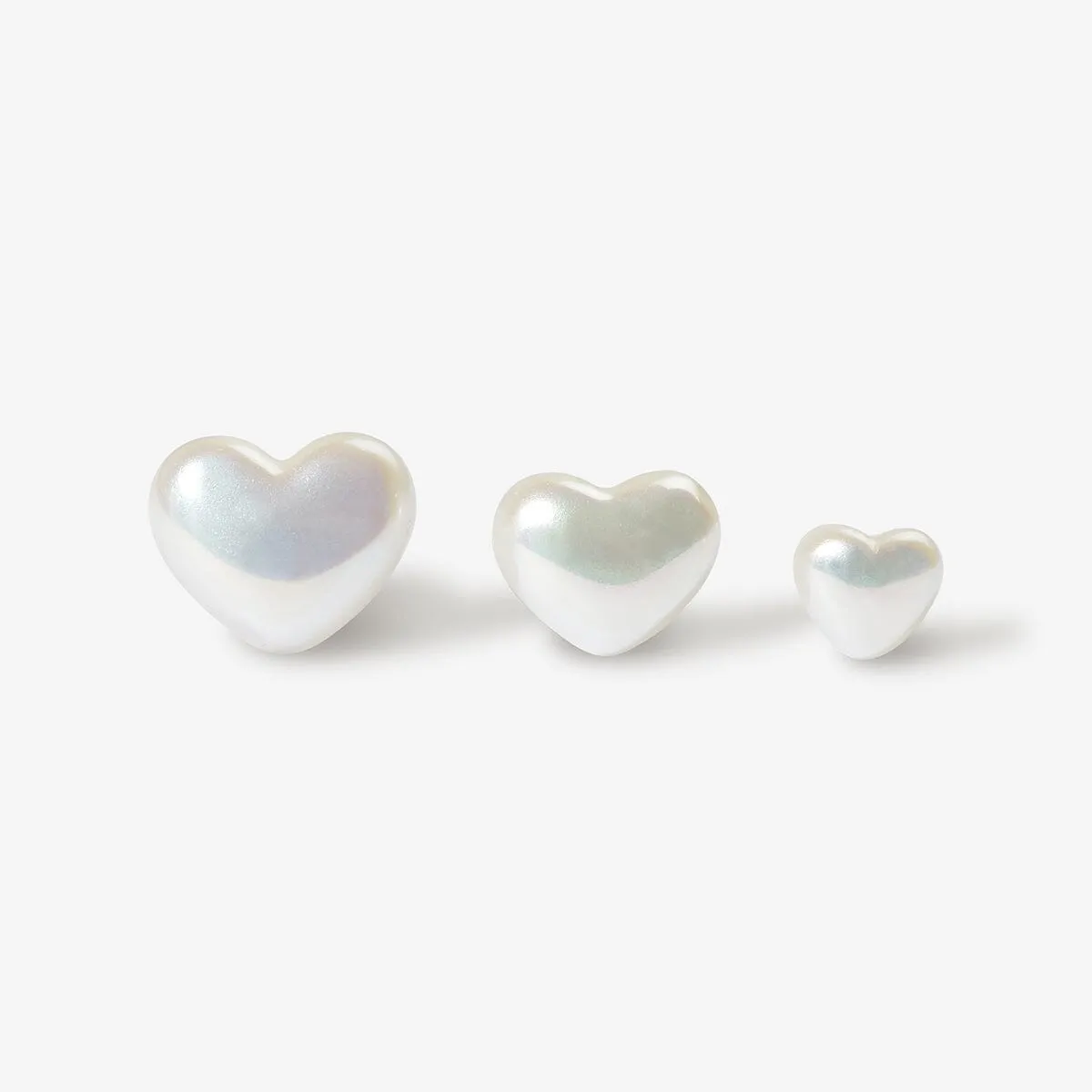 Puffy pearl hearts 3-piece piercing set sold by Adornmonde
