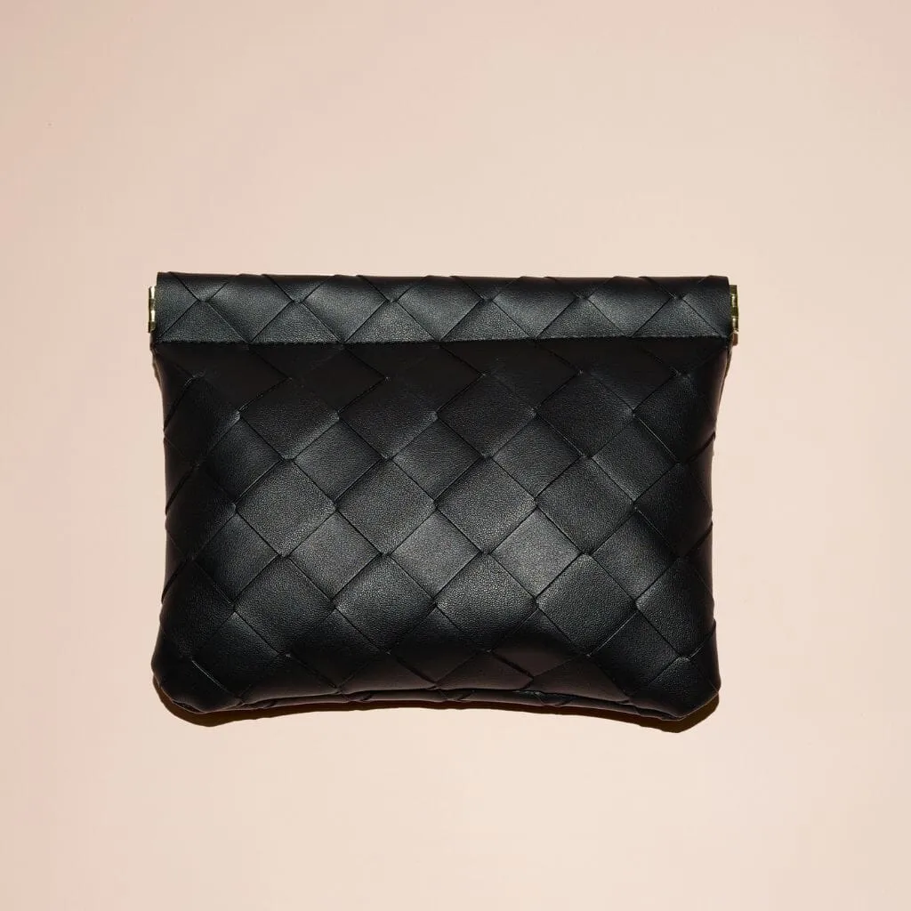 Large black woven clutch sold by Adornmonde