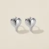Bae heart midi huggie earrings white gold sold by Adornmonde