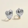 Bae heart midi huggie earrings white gold sold by Adornmonde