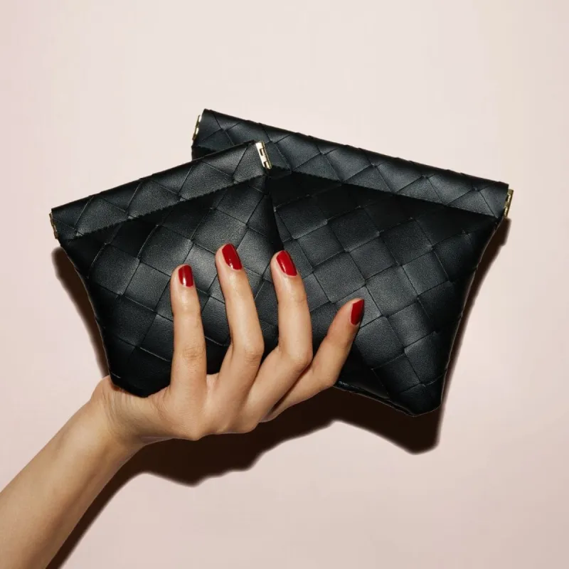 Large and small black woven pouches sold by Adornmonde
