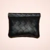 Large and small black woven pouches sold by Adornmonde