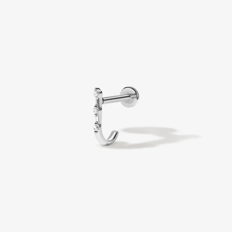 Lane diamond J piercing sold by Adornmonde