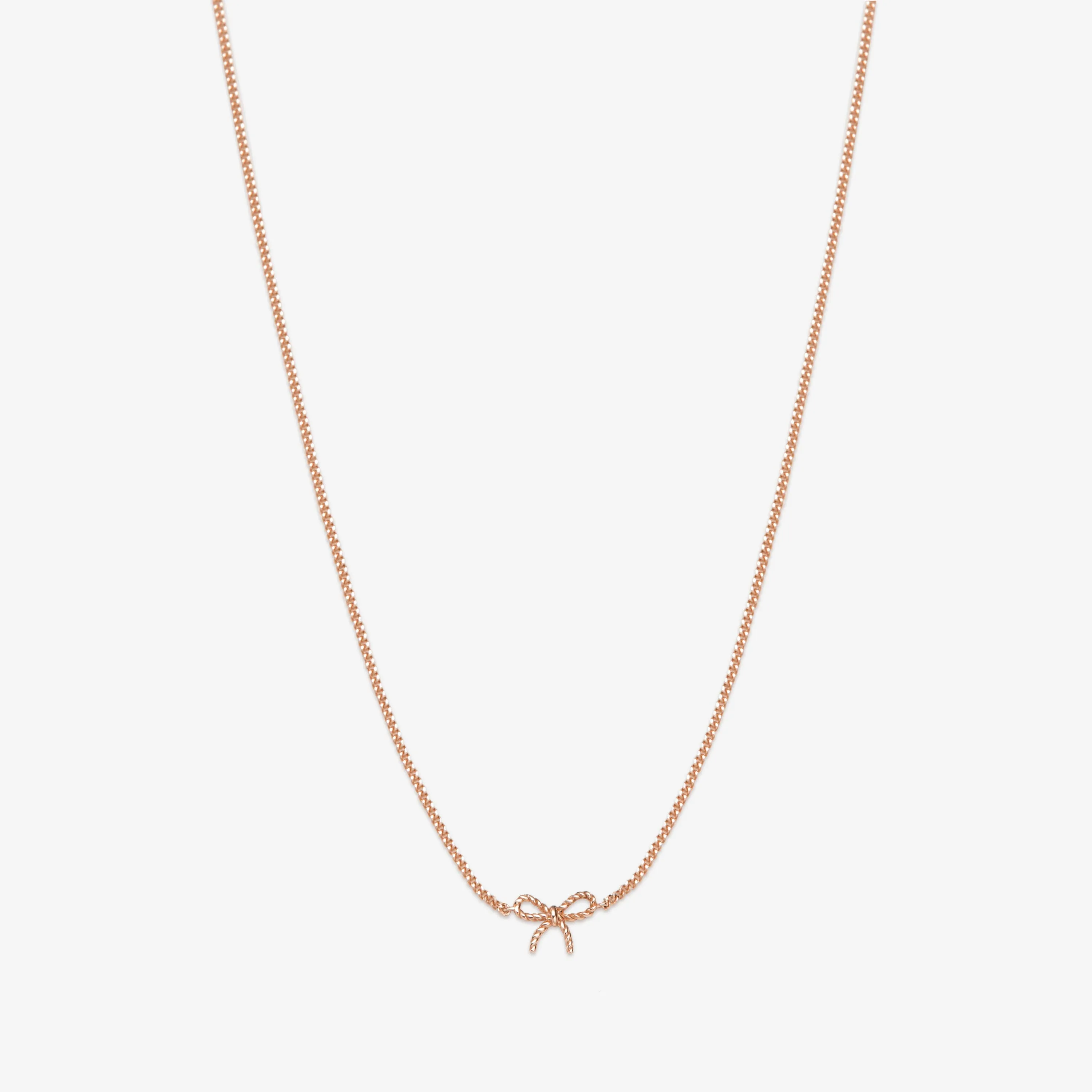 Atticus micro bow necklace sold by Adornmonde